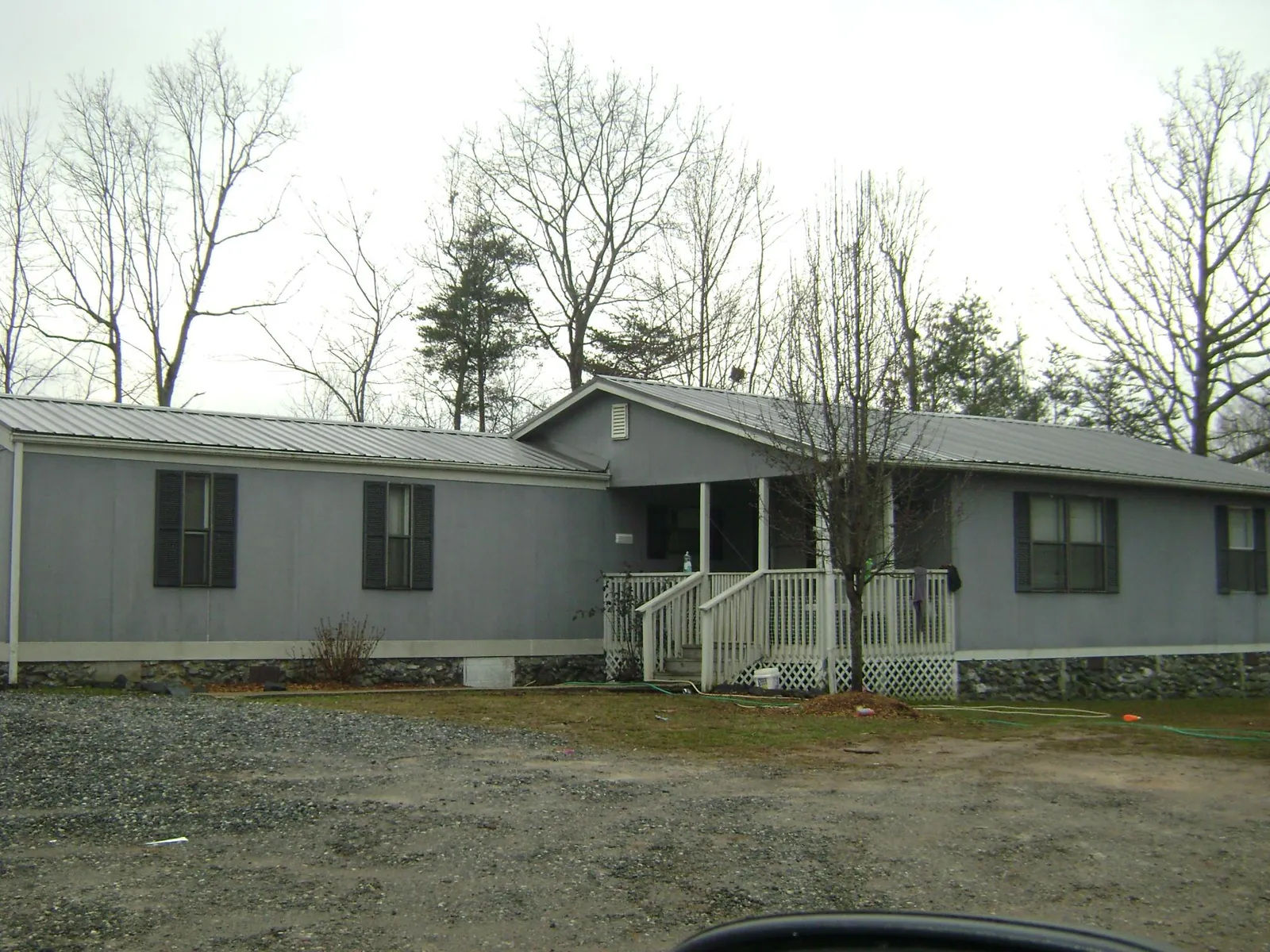 Metal roof over a manufactured home with a covered front porch in Harrington